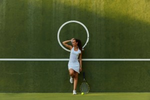 Pacific Islander woman standing on tennis court